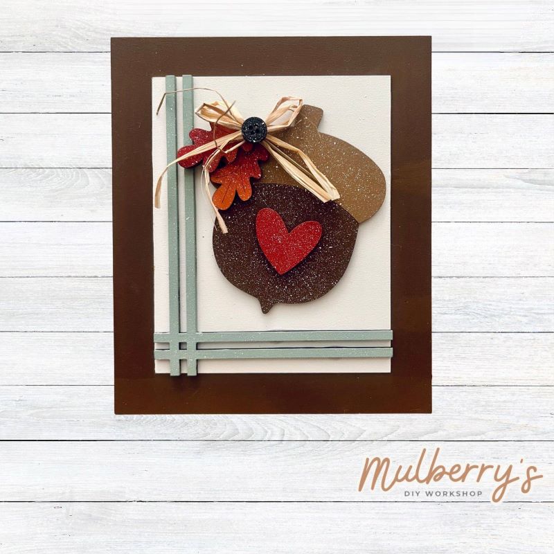 Our Interchangeable Rectangle Frame measures roughly 6.5" wide & 8" tall.
This project can easily be changed out for holidays, seasons and other themes. Because the frame leans back with the use of an easel, no magnets or adhesive hook and loop is needed.
The set includes the rectangle frame and acorn insert.