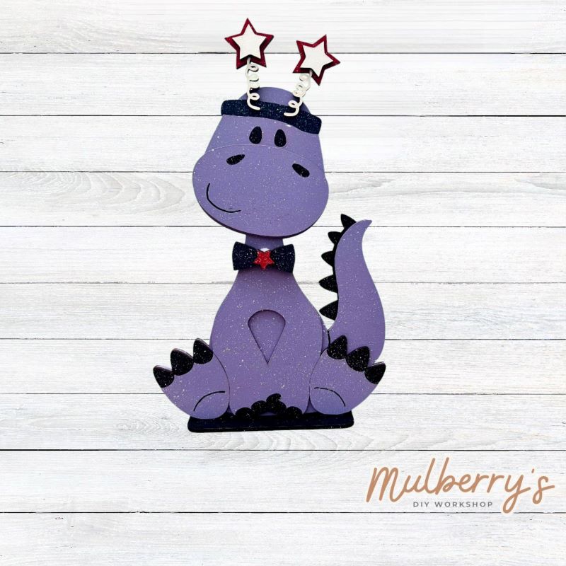 Our brachiosaurus dinosaur is super cute! It's approximately 13" tall and can be paired with your favorite seasonal/holiday insert.
This set includes the interchangeable brachiosaurus dinosaur and your choice of July 4th inserts:
-Headband with Bow Tie
-Headbow
-Statue of Liberty Spike Hat
Please note that different inserts fit each type of dinosaur base differently. For our interchangeable brachiosaurus, we recommended pairing it with the headband and bowtie inserts.