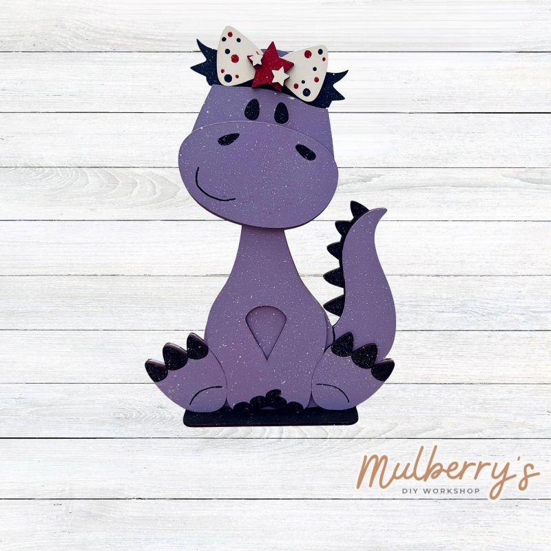 Our brachiosaurus dinosaur is super cute! It's approximately 13" tall and can be paired with your favorite seasonal/holiday insert.
This set includes the interchangeable brachiosaurus dinosaur and your choice of July 4th inserts:
-Headband with Bow Tie
-Headbow
-Statue of Liberty Spike Hat
Please note that different inserts fit each type of dinosaur base differently. For our interchangeable brachiosaurus, we recommended pairing it with the headband and bowtie inserts.
