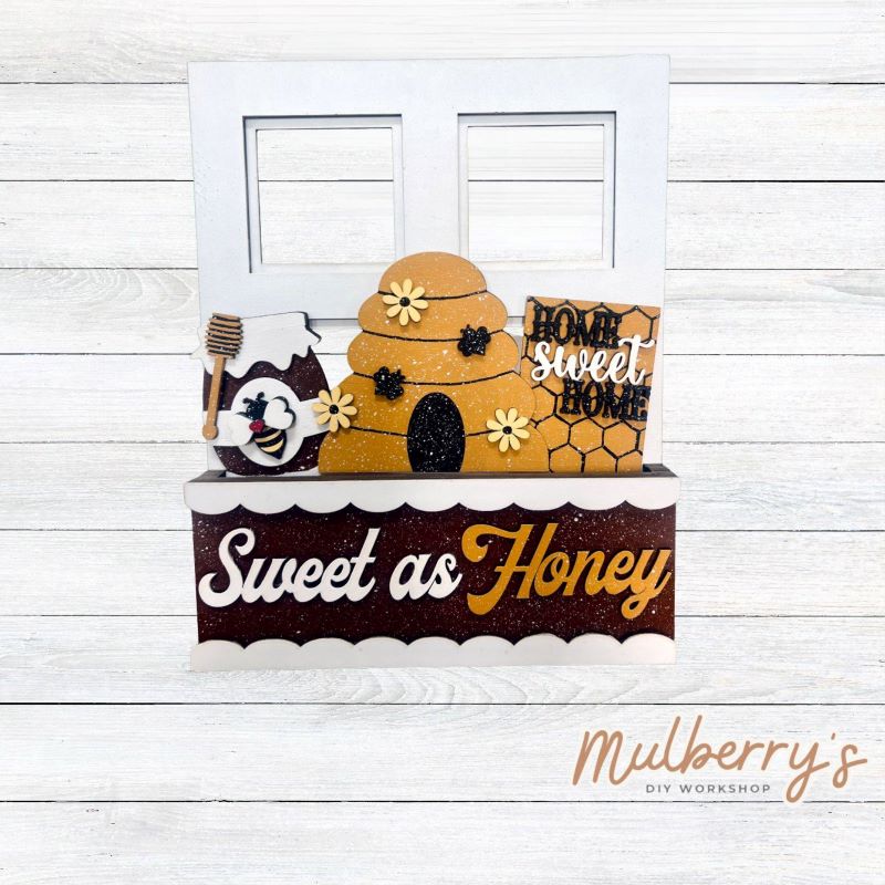 Check out our newest interchangeable project...our window box! It's the perfect project to add to your seasonal/holiday decor! It's approximately 9" wide by 11.5" tall.
Includes window box base with Bee insert.