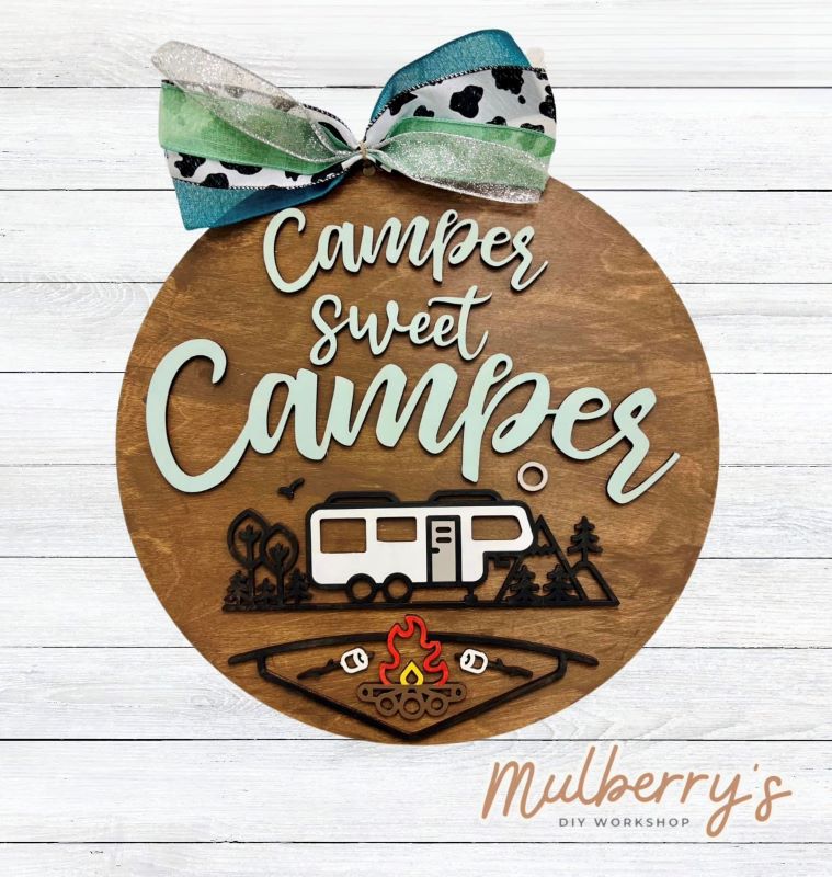 Needing a door hanger for your camper? We have you covered with our Camper Sweet Camper 18-inch door hanger. There are two types of campers to choose from: pull-behind camper and 5th wheel.