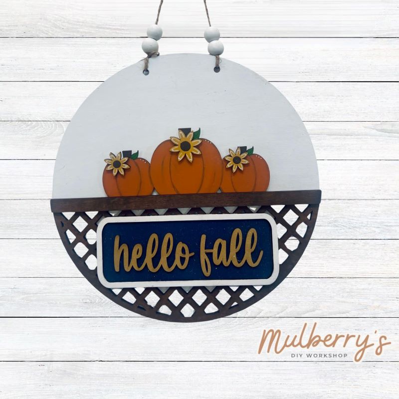 Welcome family and friends with our interchangeable lattice round door hanger! Simply swap out inserts to match the different holidays and seasons! It's approximately 10.5" in diameter. Includes: Lattice Round Door Hanger with Fall Inserts. Additional inserts are available to purchase.
