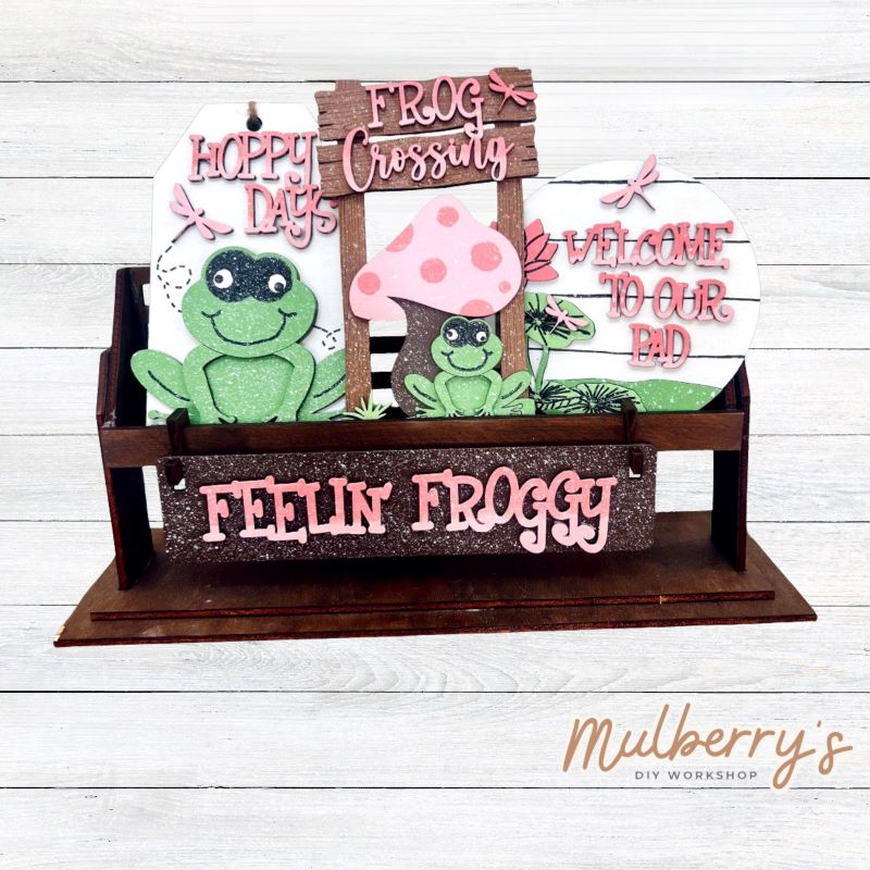 It doesn't get any cuter than our little rustic crate! It's a perfect add on accessory to your décor. It's approximately 13" long.
Includes: Crate and Spring Flower Inserts.
Spring Frog inserts include Hoppy Days tag, Frog Crossing sign, Welcome To Our Pad round, and the Feelin' Froggy banner.