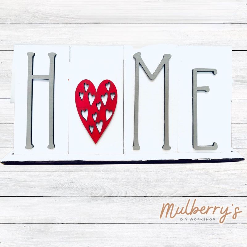 Looking for the perfect shelf sitter? Check out our interchangeable HOME shelf sitter! It's approximately 7" tall by 14" wide. Perfect for every holiday or season! This set includes the interchangeable HOME shelf sitter base and the heart insert. Additional inserts are available under Interchangeable Bases.