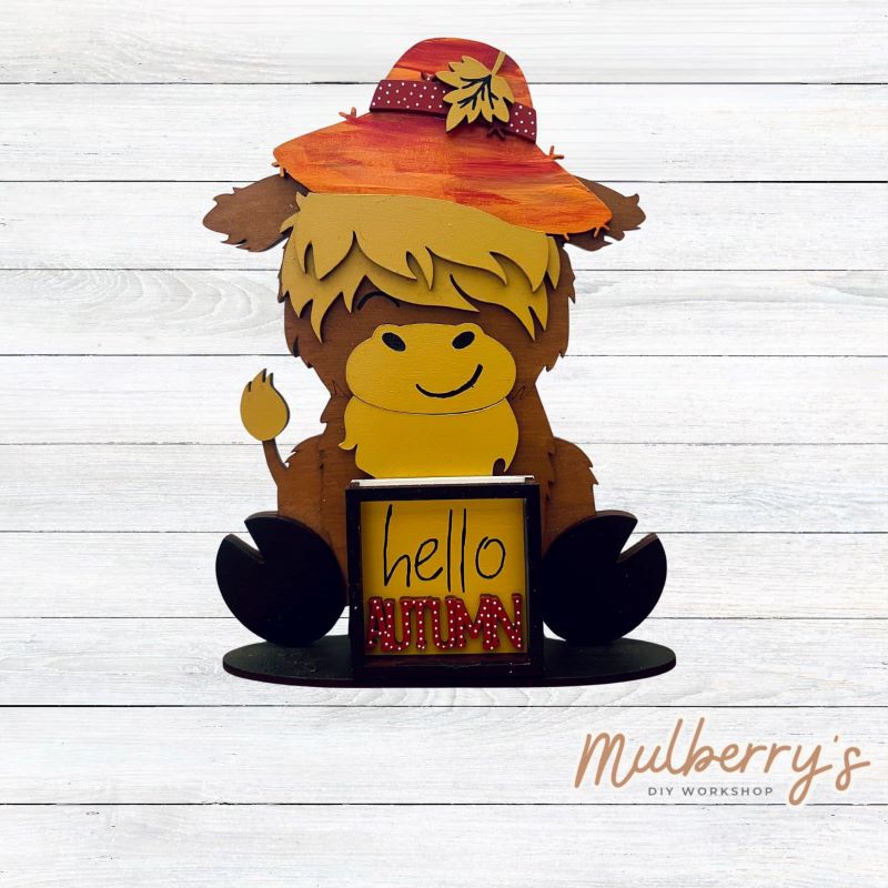 We love our interchangeable highland cow! It's approximately 9" tall and can be paired with your favorite seasonal/holiday insert. This set includes the interchangeable highland cow and the fall inserts.
