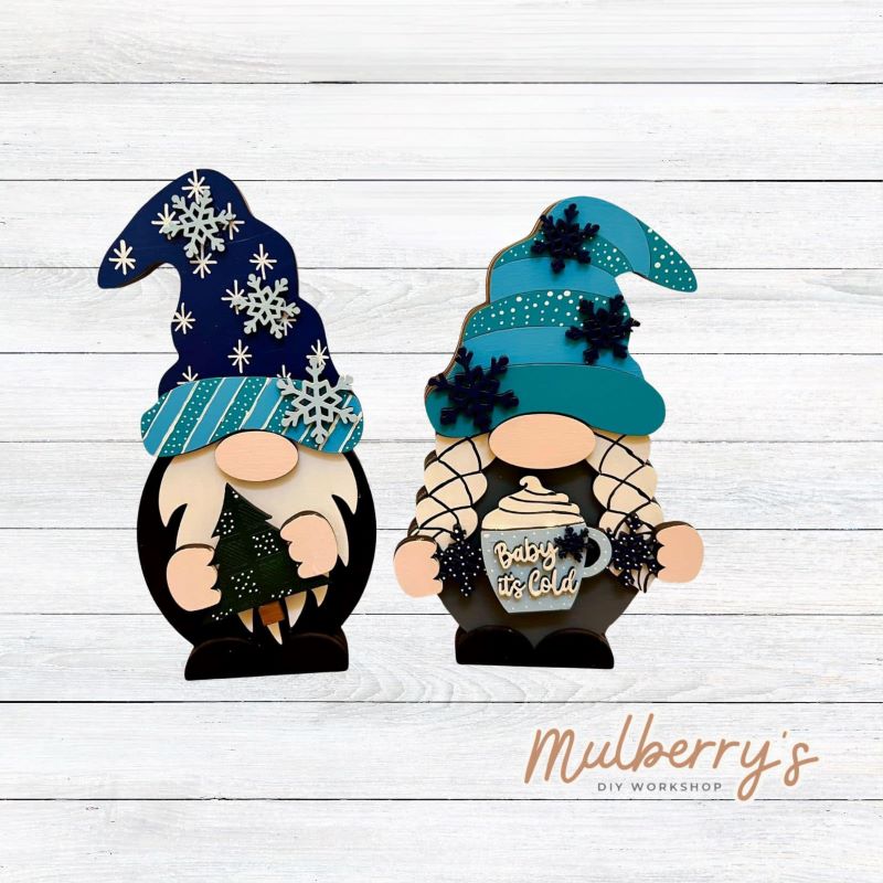 Our interchangeable mini gnomes are approximately 9" tall. They are 3 layers; therefore, they will stand freely. There are two choices. Hats and Hands are interchangeable and can be switched out for every holiday/season. Scrapbook paper embellishment is NOT included. Includes interchangeable gnomes and winter inserts.