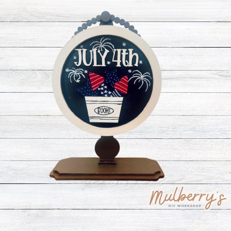 We love our interchangeable tabletop! It's approximately 10" tall and can display your favorite seasonal/holiday insert. This set includes the interchangeable tabletop and the July 4th insert.