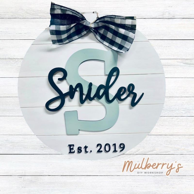 Your family name and established year can be personalized on this 18-inch door hanger A perfect gift for newlyweds, new home buyers, or for yourself.