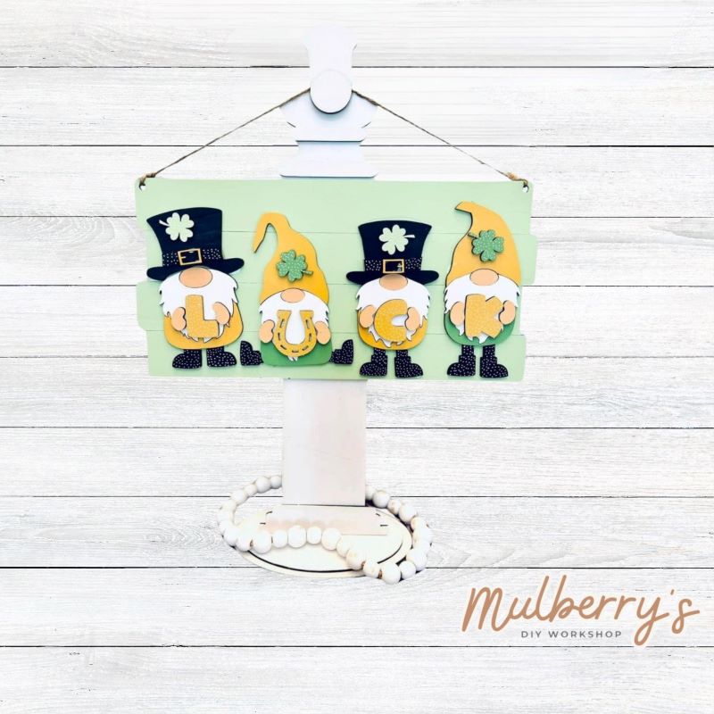 Our luck gnomes mini door hanger is just too cute! Approximately 14" wide by 7.5" tall.