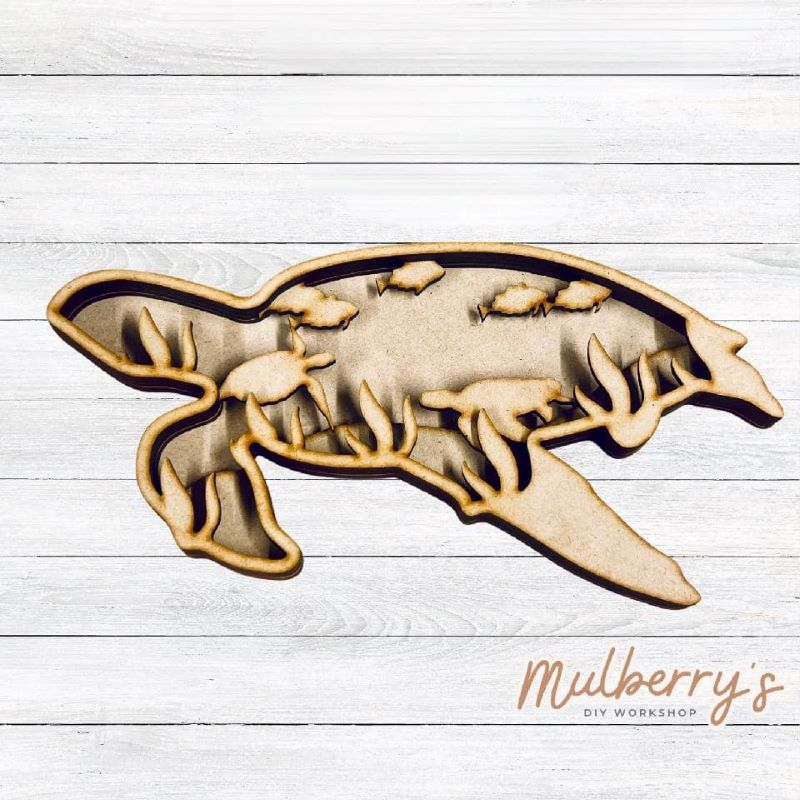 Swim away with our 5-layered sea turtle! Approximately 9.5" wide by 5" tall.