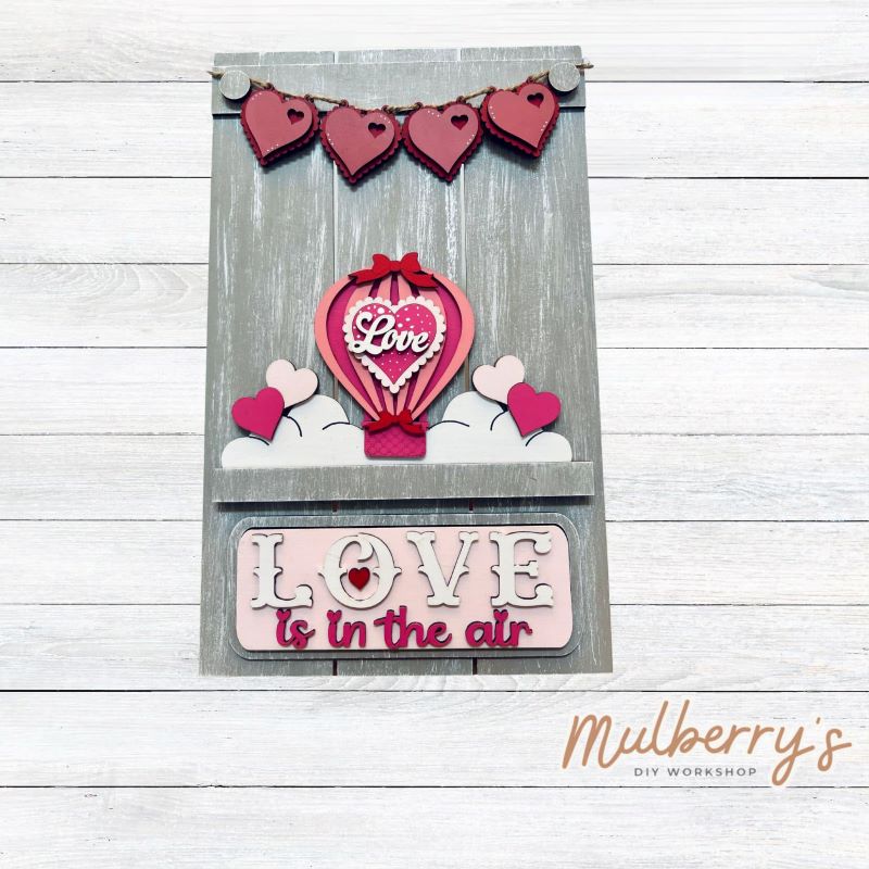 Our Interchangeable Pallet Stand measures roughly 15" tall by 9" wide. This project can easily be changed out for holidays, seasons and other themes. The set includes the pallet stand and valentine hot air ballon inserts.