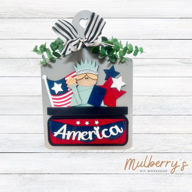 This Interchangeable Breadboard measures roughly 9" wide & 13.5" tall. This project can easily be changed out for holidays, seasons and other themes. Because the breadboard leans back with the use of an easel, no magnets or adhesive hook and loop is needed. The set includes the breadboard and patriotic inserts.