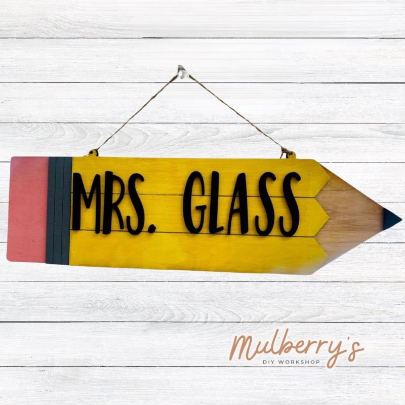 Our personalized pencil mini door hanger would be the perfect addition to your classroom! Approximately 5.5" tall by 18" wide.