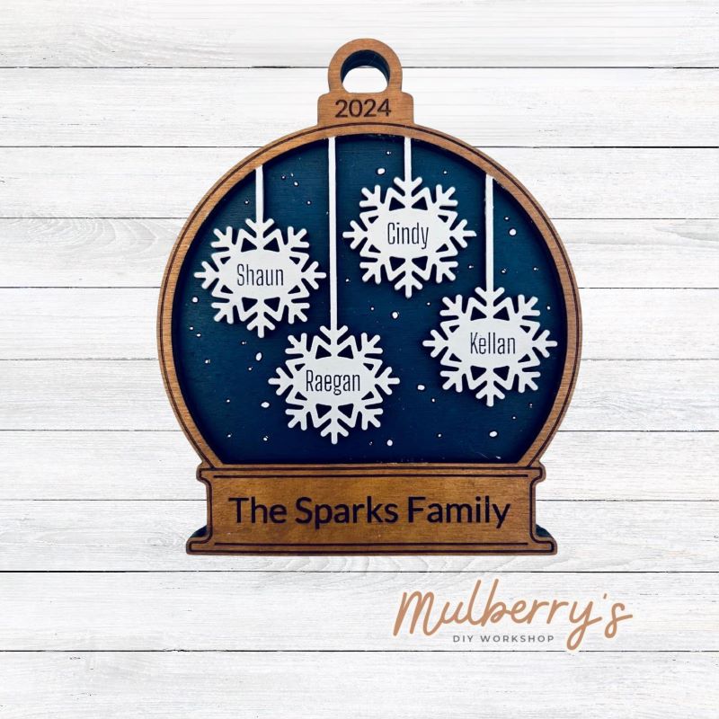 Our personalized snowglobe ornament is the perfect ornament for your tree! Approximately 5" tall. You can have up to 7 snowflakes.