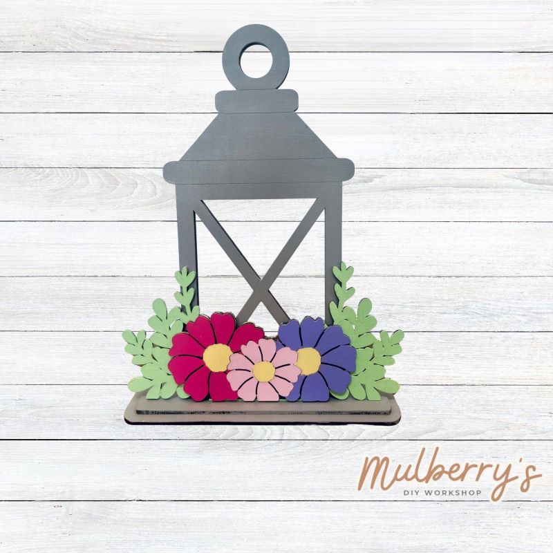 We love our interchangeable lantern! It's approximately 11" tall and can display your favorite seasonal/holiday insert.
This set includes the interchangeable lantern and the spring insert.
