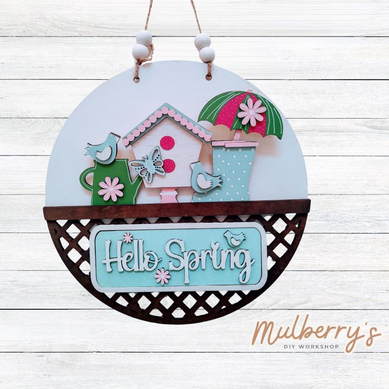 Welcome family and friends with our interchangeable lattice round door hanger! Simply swap out inserts to match the different holidays and seasons! It's approximately 10.5" in diameter. Includes: Lattice Round Door Hanger with Spring Inserts. Additional inserts are available to purchase.