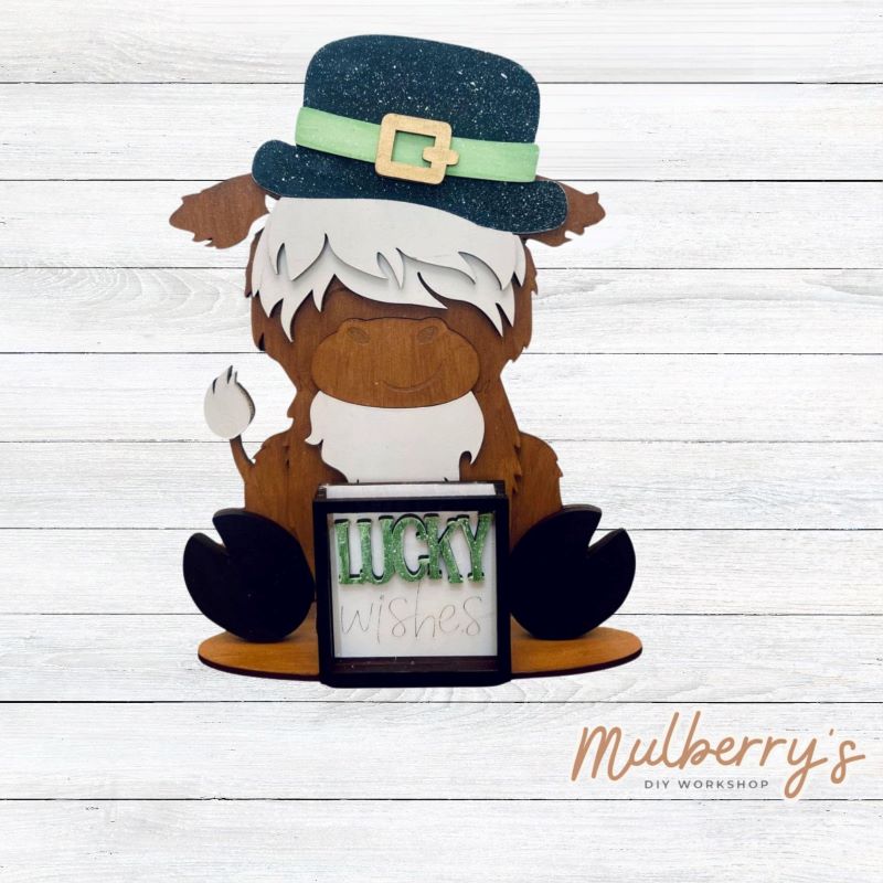 We love our interchangeable highland cow! It's approximately 9" tall and can be paired with your favorite seasonal/holiday insert. This set includes the interchangeable highland cow and the st. patty inserts.