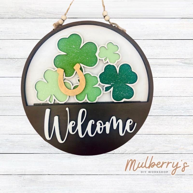 Welcome family and friends with our interchangeable welcome door hanger! Simply swap out inserts to match the different holidays and seasons! It's approximately 10.5" in diameter. Includes: Welcome Door Hanger with Shamrock Insert. Additional inserts are available to purchase.