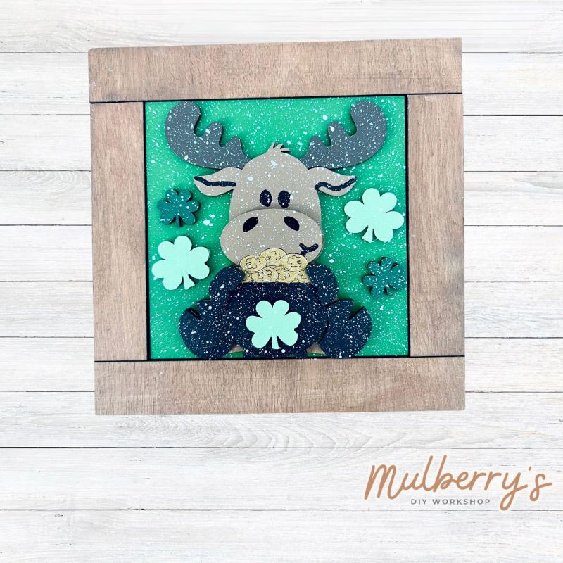 Our interchangeable square frame is the perfect way to display the different seasonal and holiday decorative tiles! Choose your favorite st. patty moose decorative tile to display inside! This listing includes the base and choice of one st. patty moose insert. Approximately 6" in diameter.