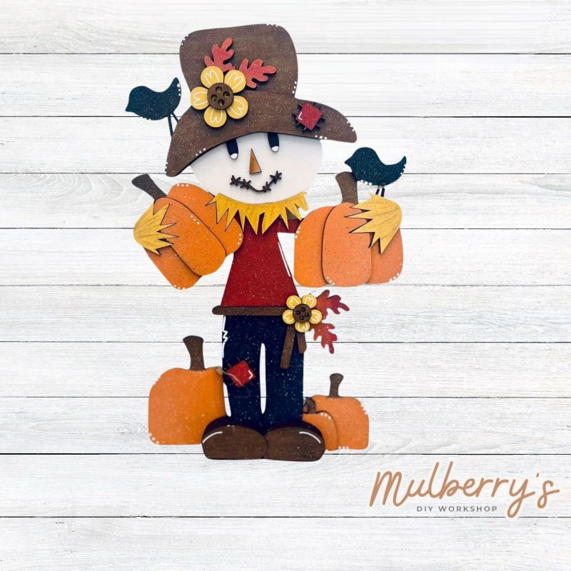 Our stand-up mini scarecrow is fall-tastic! Approximately 13" tall by 9" wide.