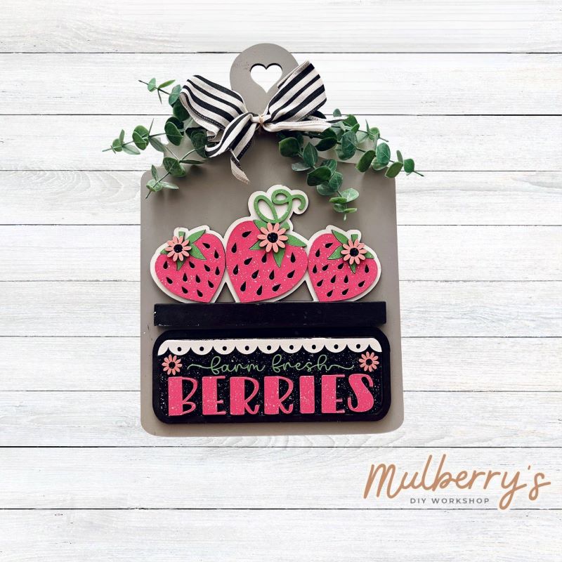 This Interchangeable Breadboard measures roughly 9" wide & 13.5" tall.
This project can easily be changed out for holidays, seasons and other themes. Because the breadboard leans back with the use of an easel, no magnets or adhesive hook and loop is needed.
The set includes the breadboard and strawberry inserts.