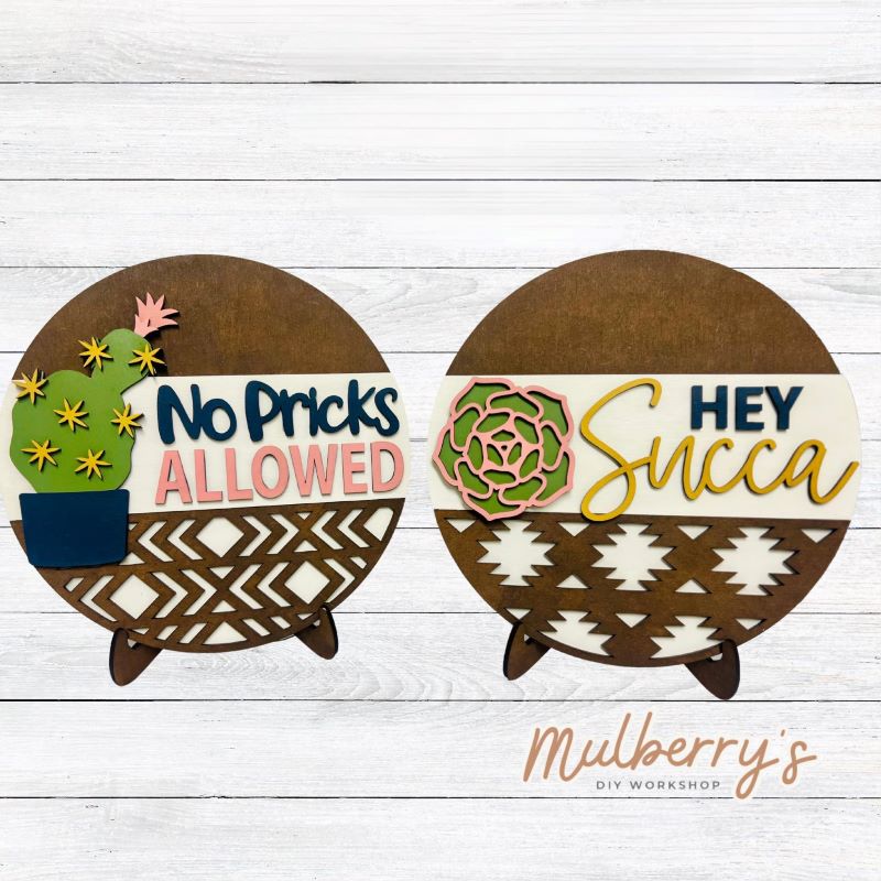 There are two choices for our succulent rounds: No Pricks Allowed and Hey Succa. Each sign is roughly 9 inches in diamter. Optional stand is available.