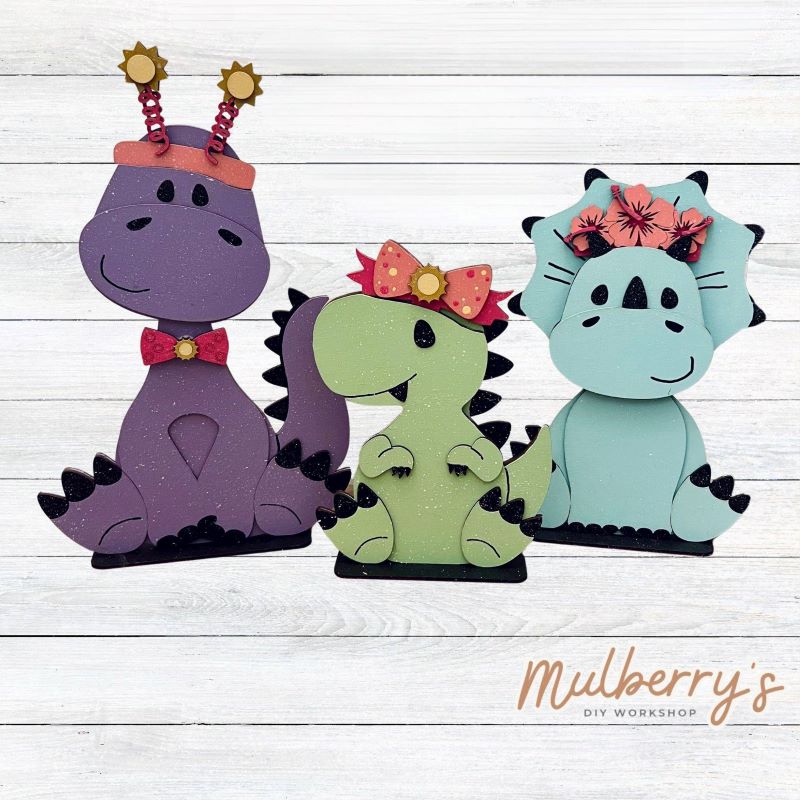 Our summer inserts pair perfectly with our Interchangeable Dinosaurs, pictured in the second picture and sold separately.
Please note that different inserts fit each type of dinosaur base differently. For our interchangeable dinosaurs, we recommended pairing each with the following:
-Brachiosaurus with Headband & Bow Tie
-T-Rex with Headbow
-Triceratops with Tropical Flower Lei