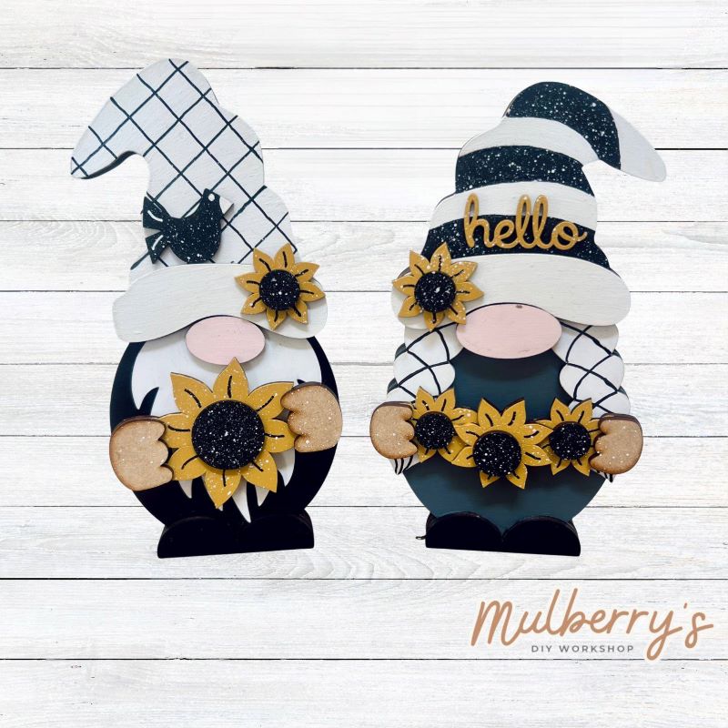 Our interchangeable mini gnomes are approximately 9" tall. They are 3 layers; therefore, they will stand freely.
There are two choices:
1. Gnome with beard
2. Gnome with braids
Hats and Hands are interchangeable and can be switched out for every holiday/season. Scrapbook paper embellishment is NOT included.
Includes interchangeable gnomes and sunflower inserts.