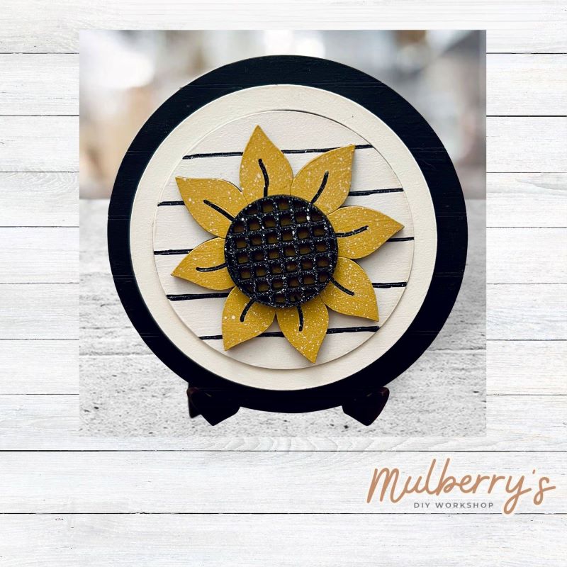 We love our mini interchangeable round stand! It's approximately 4.5 inches in diameter and can display your favorite seasonal/holiday insert.
This set includes mini interchangeable round stand with circle and sunflower insert.