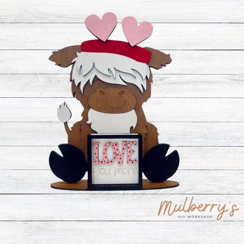 We love our interchangeable highland cow! It's approximately 9" tall and can be paired with your favorite seasonal/holiday insert. This set includes the interchangeable highland cow and the valentine inserts.