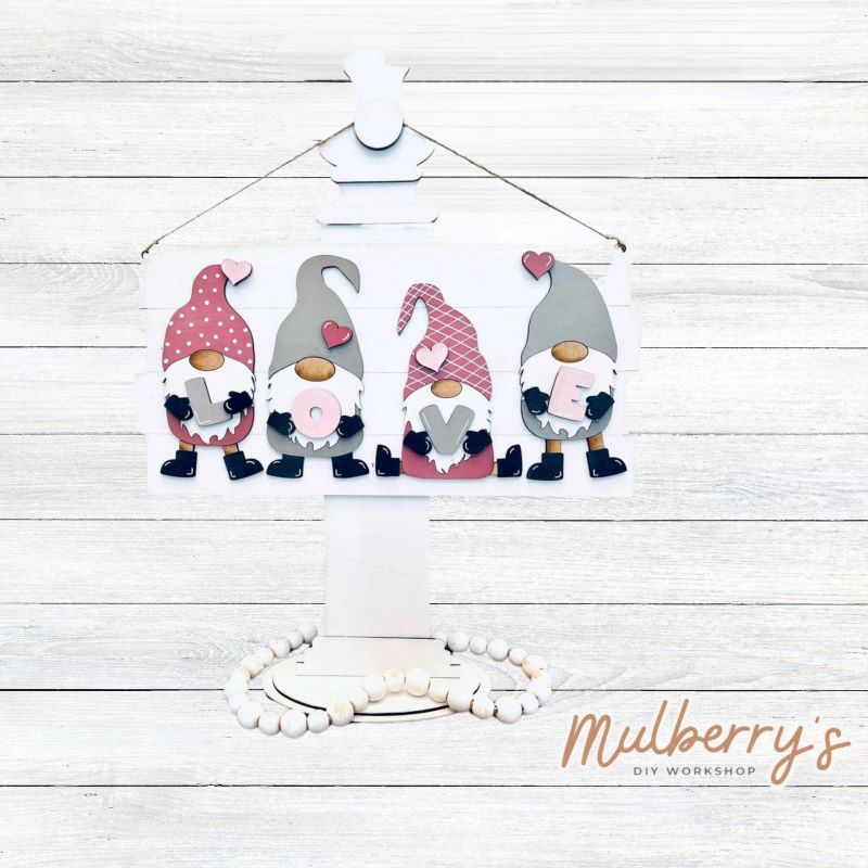 Our Love Gnomes mini door hanger is the perfect project for gnome lovers! Approximately 14" wide by 7.5" tall.