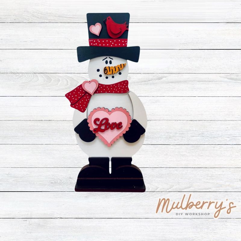 Our cute stand-up valentine snowman is approximately 10.5" tall by 5" wide.
