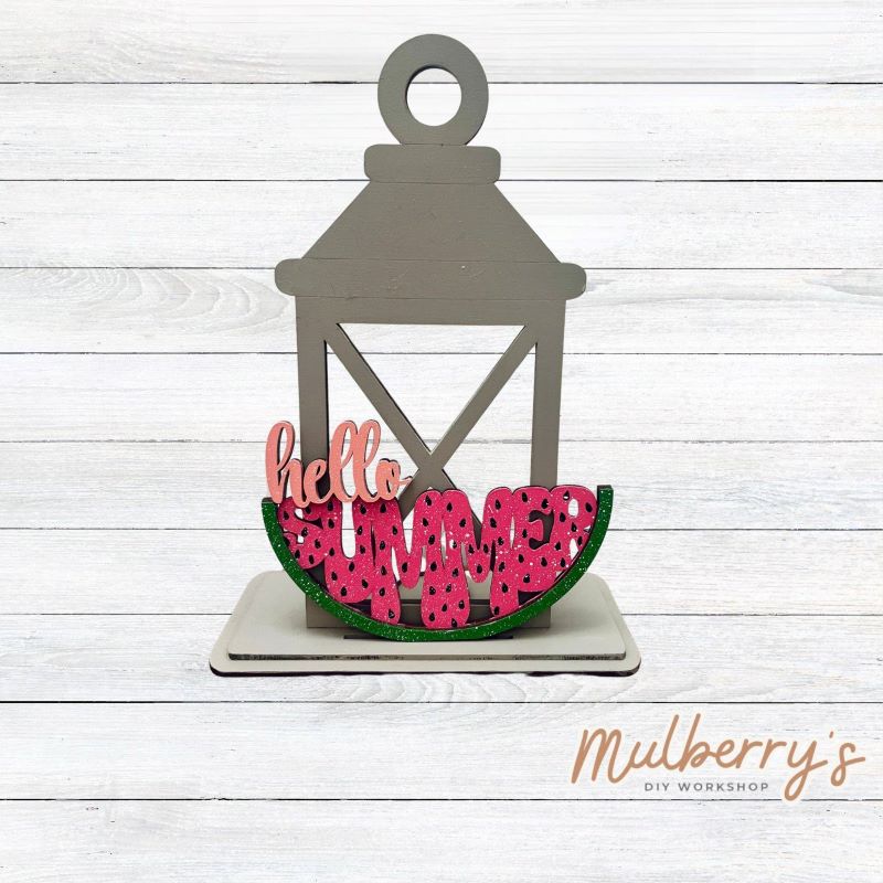 We love our interchangeable lantern! It's approximately 11" tall and can display your favorite seasonal/holiday insert.
This set includes the interchangeable lantern and the watermelon insert.