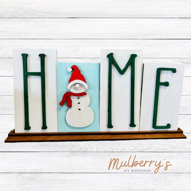 Looking for the perfect shelf sitter? Check out our interchangeable HOME shelf sitter! It's approximately 7" tall by 14" wide. Perfect for every holiday or season! This set includes the interchangeable HOME shelf sitter and the snowman insert.