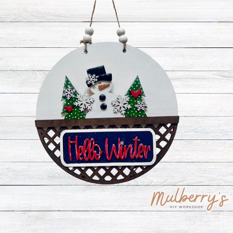 Welcome family and friends with our interchangeable lattice round door hanger! Simply swap out inserts to match the different holidays and seasons! It's approximately 10.5" in diameter. Includes: Lattice Round Door Hanger with Winter Inserts. Additional inserts are available to purchase.