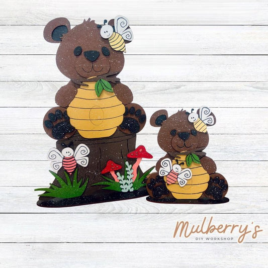 Our adorable bears with honeycombs are bee-tastic! The small bear is approximately 7.5" tall and the large bear is approximately 15" tall. Stands are included with each bear.