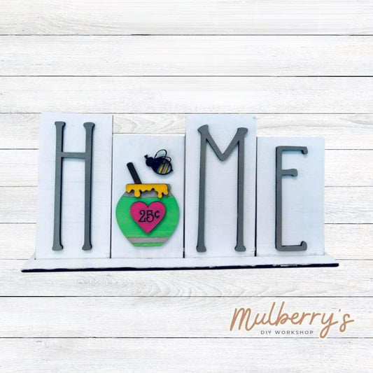 Looking for the perfect shelf sitter? Check out our interchangeable HOME shelf sitter! It's approximately 7" tall by 14" wide. Perfect for every holiday or season!  This set includes the interchangeable HOME shelf sitter base and the bee insert. Additional inserts are available under Interchangeable Bases.