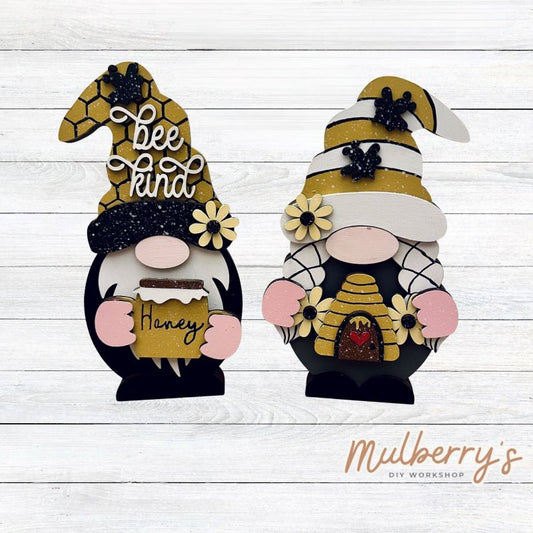Our interchangeable mini gnomes are approximately 9" tall. They are 3 layers; therefore, they will stand freely.

There are two choices:

1. Gnome with beard

2. Gnome with braids

Hats and Hands are interchangeable and can be switched out for every holiday/season. Scrapbook paper embellishment is NOT included.

Includes interchangeable gnomes and bee inserts.