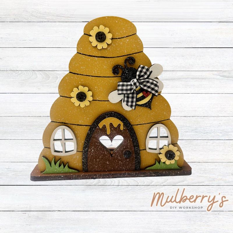 Our little beehive shelf sitter is too buzz-erfect! Approximately 7.5" tall. Please note that a physical tea light is NOT provided with this project.