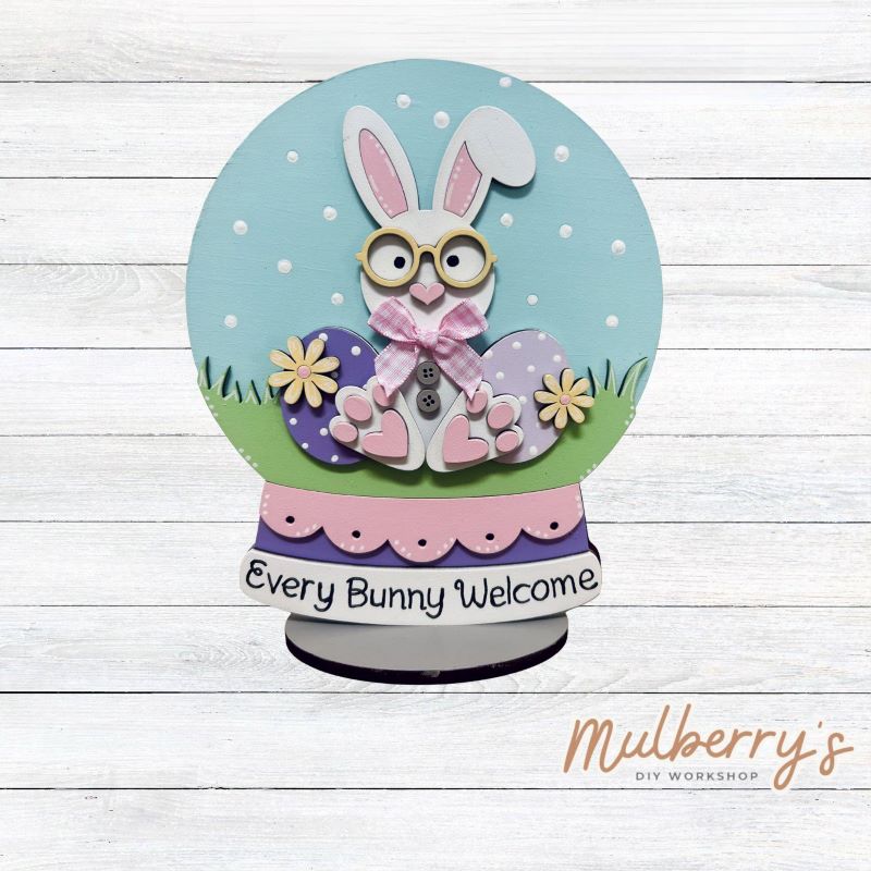 "Every Bunny Welcome" with this Easter bunny snowglobe shelf sitter! Approximately 8" tall. Includes stand.