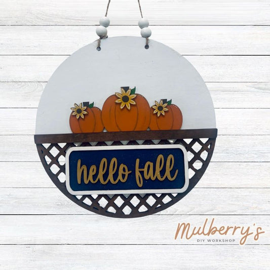 Welcome family and friends with our interchangeable lattice round door hanger! Simply swap out inserts to match the different holidays and seasons! It's approximately 10.5" in diameter.  Includes: Lattice Round Door Hanger with Fall Inserts. Additional inserts are available to purchase.