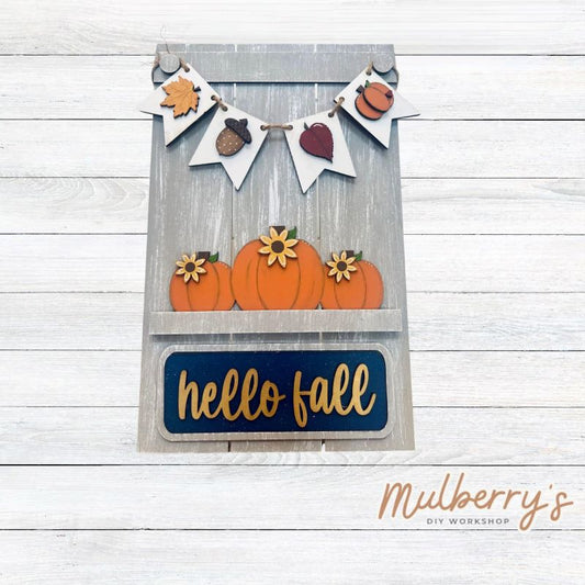 Our Interchangeable Pallet Stand measures roughly 15" tall by 9" wide.  This project can easily be changed out for holidays, seasons and other themes. The set includes the pallet stand and fall inserts.
