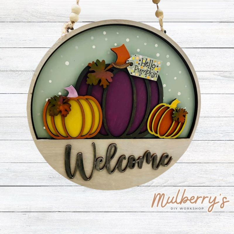 Welcome family and friends with our interchangeable welcome door hanger! Simply swap out inserts to match the different holidays and seasons! It's approximately 10.5" in diameter.  Includes: Welcome Door Hanger with Hello Pumpkin Insert. Additional inserts are available to purchase.