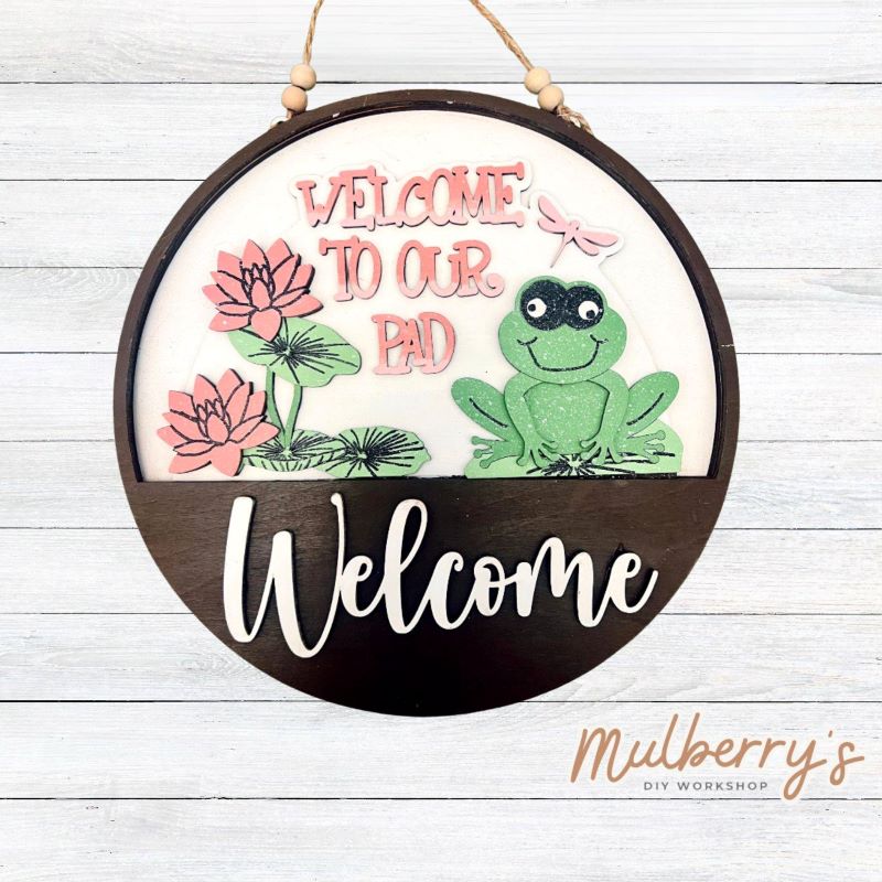 Welcome family and friends with our interchangeable welcome door hanger! Simply swap out inserts to match the different holidays and seasons!

It's approximately 10.5" in diameter.

Includes: Welcome Door Hanger with Welcome To Our Pad Insert. Additional inserts are available to purchase.