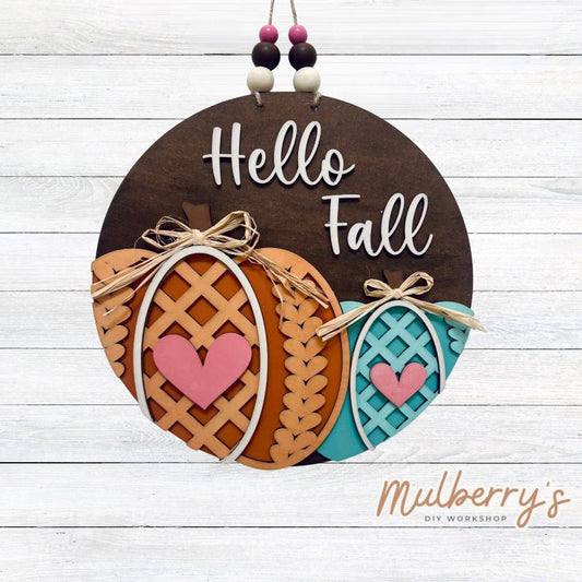 Hello fall! We have the cutest new fall pumpkin mini door hanger for you to paint! It's approximately 10.5" in diameter and comes with your choice of either beads or a mini bow!