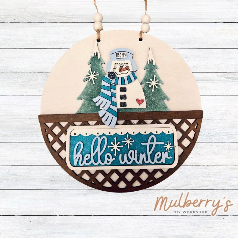 Welcome family and friends with our interchangeable lattice round door hanger! Simply swap out inserts to match the different holidays and seasons!

It's approximately 10.5" in diameter.

Includes: Lattice Round Door Hanger with Winter Inserts. Additional inserts are available to purchase.
