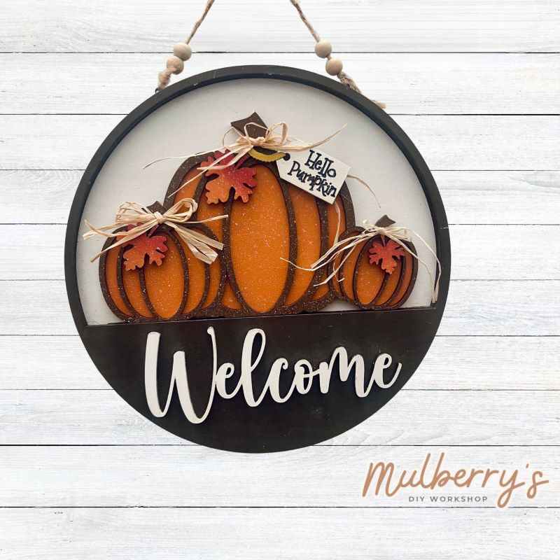 Welcome family and friends with our interchangeable welcome door hanger! Simply swap out inserts to match the different holidays and seasons!

It's approximately 10.5" in diameter.

Includes: Welcome Door Hanger with Hello Pumpkin Insert. Additional inserts are available to purchase.