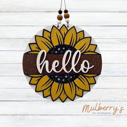 Our hello sunflower mini door hanger is so much fun to paint! Approximately 10.5" in diameter.