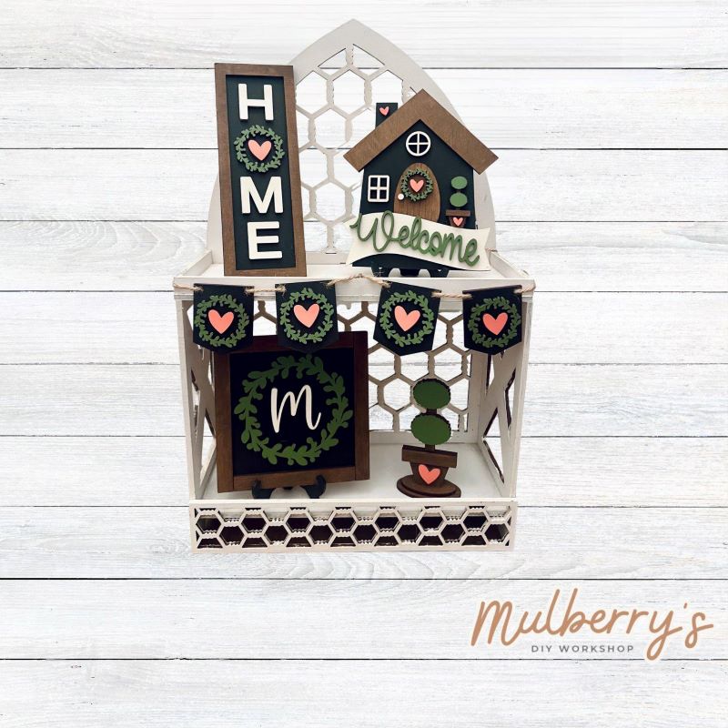 Looking for a tiered tray set to keep up all year long! We have you covered with our five-piece Home Tiered Tray set. The rectangular piece with wreath can be personalized with your last name initial. Pieces can be purchased separately too.