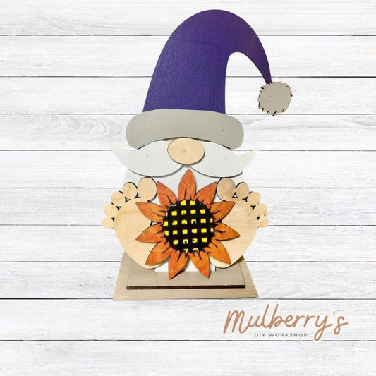 Our cute little interchangeable gnome sitter is a must! He measures 12-inches tall. Swap out his inserts to keep him ready for each holiday and season. Includes interchangeable gnome with sunflower insert.